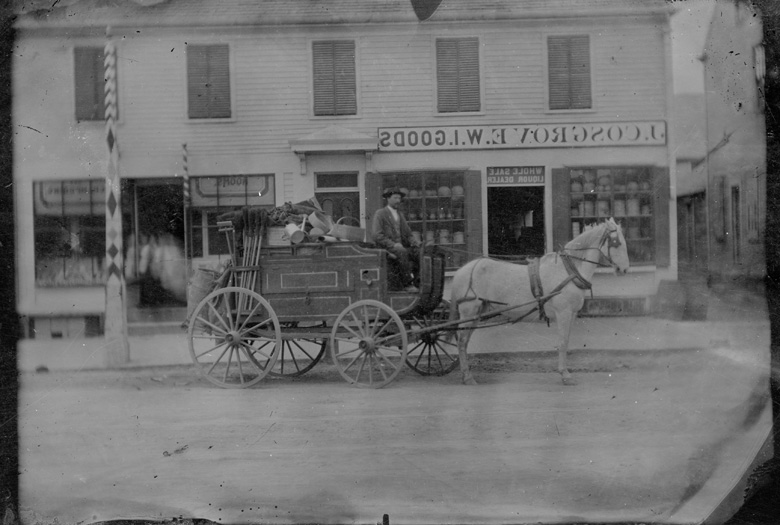 Peddler and Wagon in front of John Cosgrove, grocer in Lowell, MA